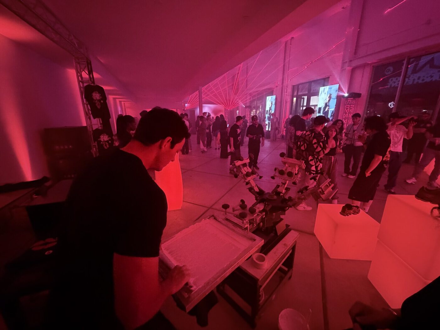 Attendees engaging with a live merch activation