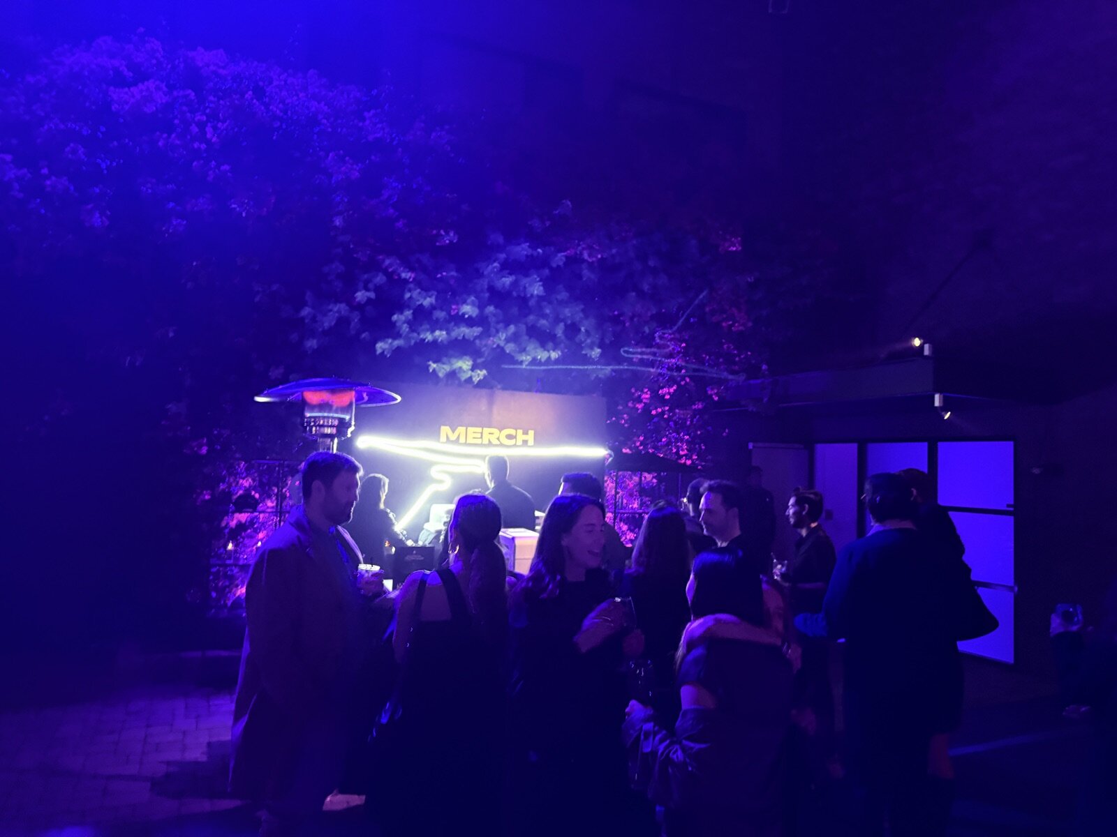 Wide view of a Merch Troop activation booth built for guest flow
